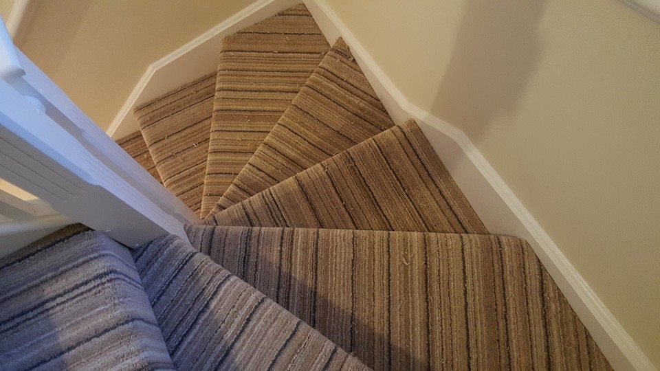 Striped Loop Pile on a 180 degree turn staircase.